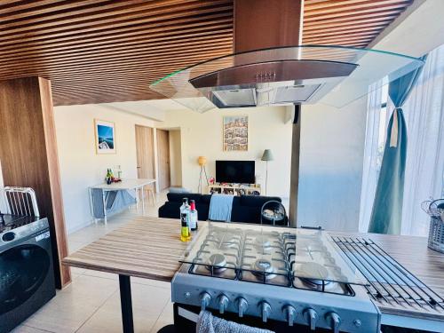 a kitchen with a stove and a table in a room at Mexico City, your Hub in coyoacán in Mexico City
