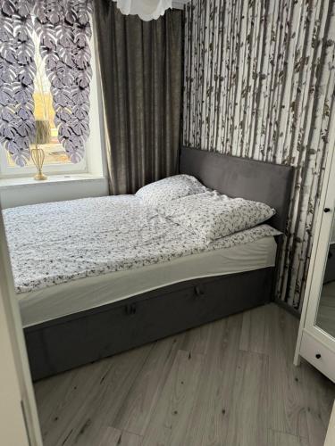 En eller flere senge i et værelse på Apartament Zuza