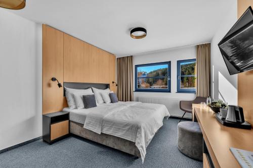 Llit o llits en una habitació de Resort Špindl