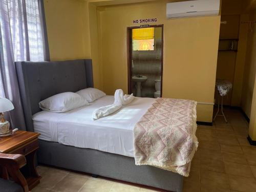 Postel nebo postele na pokoji v ubytování Chaleanor Hotel