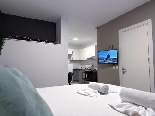 Giường trong phòng chung tại D' Suites Holiday Apartments