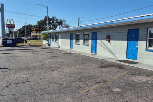 an empty parking lot in front of a building at Base Motel By OYO South Tampa in Tampa