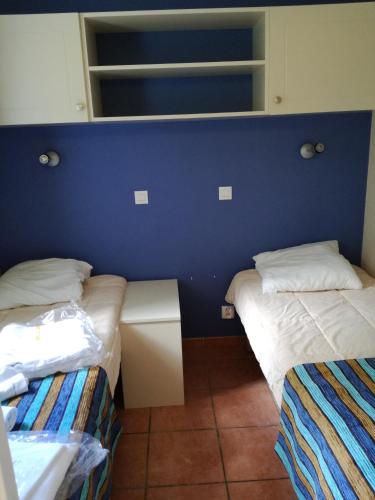 Llit o llits en una habitació de Chez Alain
