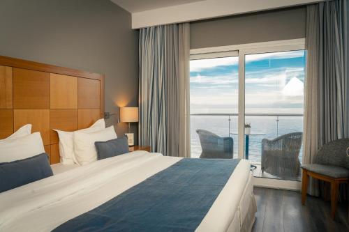 Postel nebo postele na pokoji v ubytování Golden Star City Resort