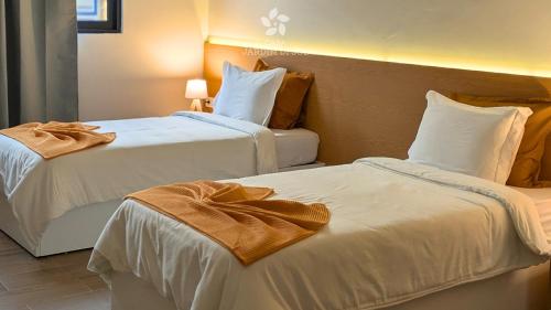 Postel nebo postele na pokoji v ubytování Casa Jardim di Sol