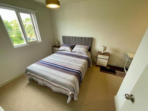 Giường trong phòng chung tại Departamento Dos Ambientes