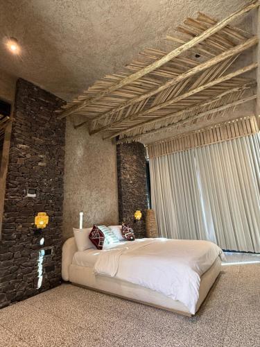 Ένα ή περισσότερα κρεβάτια σε δωμάτιο στο Muskad