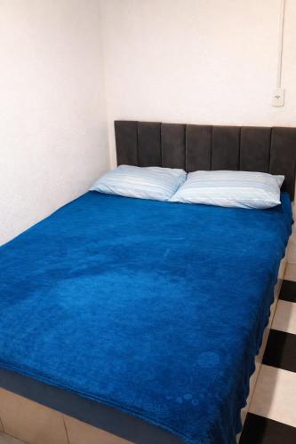 En eller flere senge i et værelse på Peró Beach Hospedaria