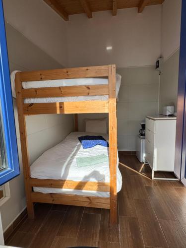 Postel nebo postele na pokoji v ubytování Quarto Santo António