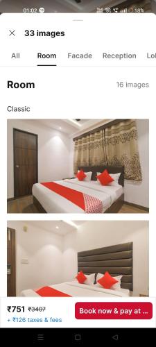 a screenshot of a hotel room with a bed with red pillows at Hotel The Rudraksh inn in Indore