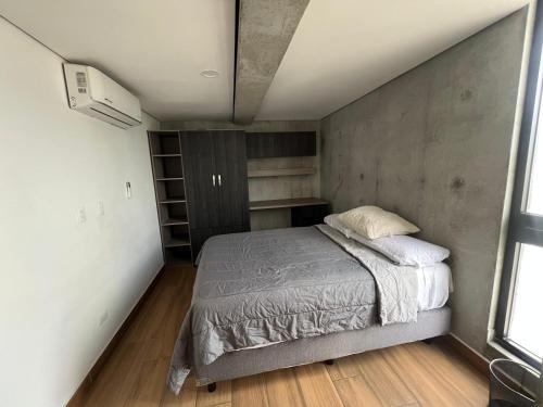 En eller flere senge i et værelse på Penthouse en Centro de Monterrey