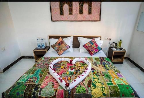 Postel nebo postele na pokoji v ubytování Rose Merry Guesthouse