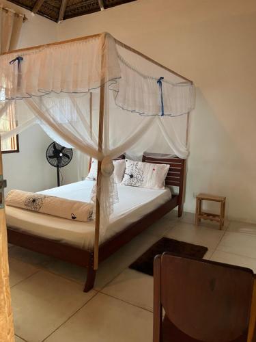 Giường trong phòng chung tại Kategha Beach Guesthouse