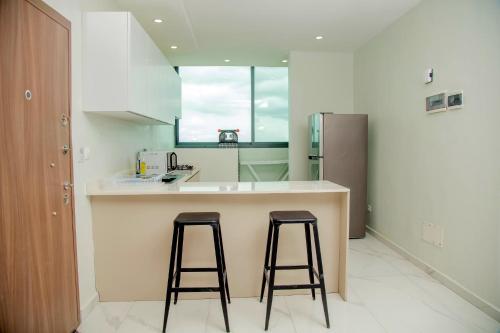 Køkken eller tekøkken på Résidence Hôtel Missikewa Cocody-Angré