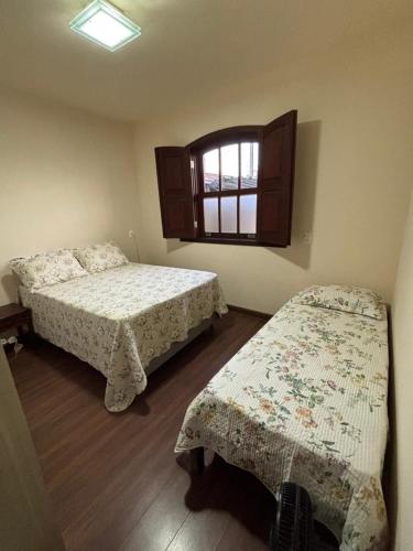 Postel nebo postele na pokoji v ubytování Morada Alecrim