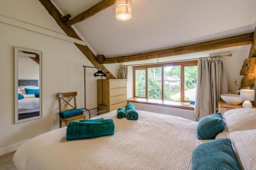 a bedroom with a large bed and a window at 4 Bed in Malham oc-c32684 in Airton