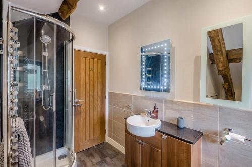 a bathroom with a sink and a shower at 4 Bed in Malham oc-c32684 in Airton