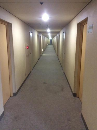 a hallway of an office building with a long corridor at Hotel Biwako Plaza in Moriyama