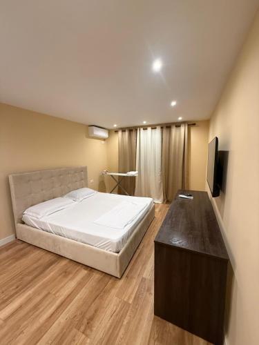 Giường trong phòng chung tại Dyrrachium Apartment