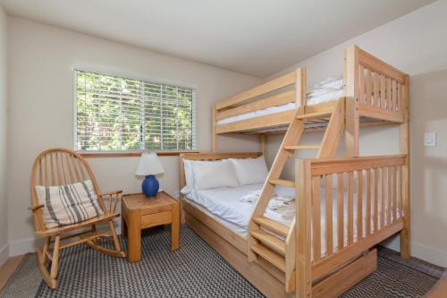 a bedroom with a bunk bed and a chair at Sierra Sanctuary in Dorrington