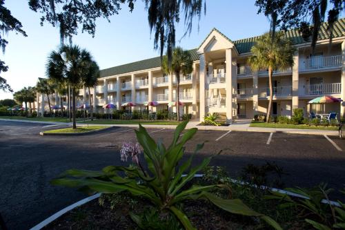 an empty parking lot in front of a hotel at Days Inn by Wyndham Port Charlotte Town Center in Port Charlotte