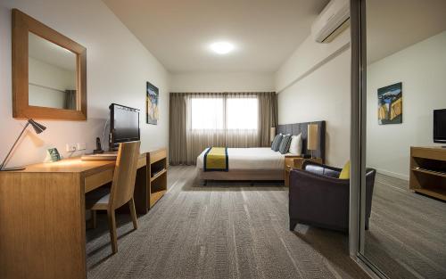 Aligned Corporate Residences Mackay tesisinde bir odada yatak veya yataklar