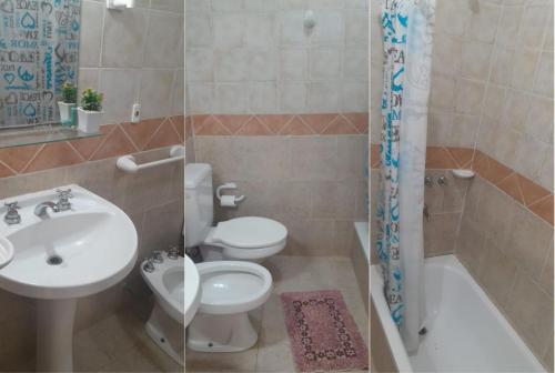 a bathroom with a toilet and a sink and a shower at Bungalow El Pini in Chajarí