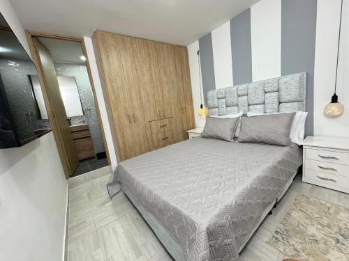 Giường trong phòng chung tại Apartamento Gold