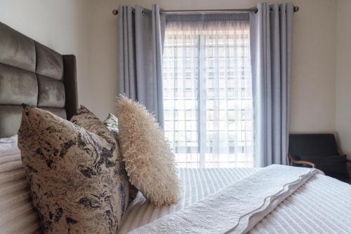 En eller flere senge i et værelse på charming retreat