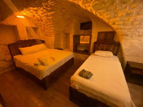 En eller flere senge i et værelse på Ayataç Konak Otel