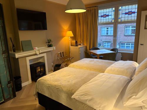 Giường trong phòng chung tại Morelstraat