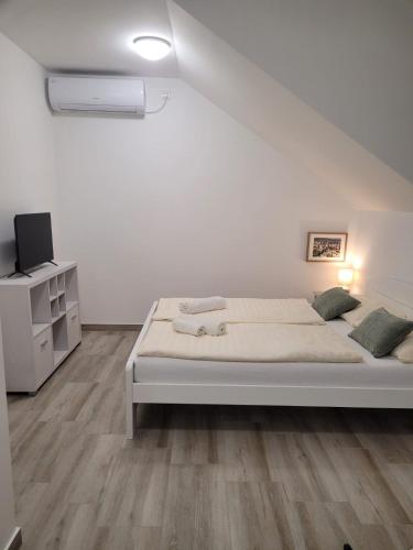 Ένα ή περισσότερα κρεβάτια σε δωμάτιο στο Beosan