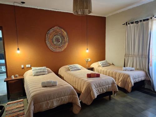 En eller flere senge i et værelse på La Genoveva Posada entre Viñedos