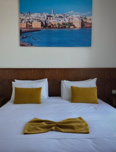 Postel nebo postele na pokoji v ubytování Hôtel Majestic Rabat Centre