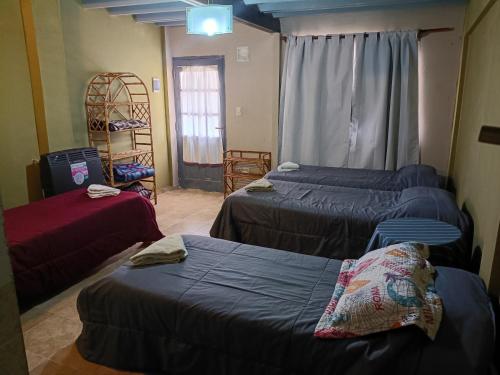 En eller flere senge i et værelse på Hospedaje 73 M