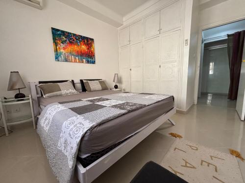 Postel nebo postele na pokoji v ubytování Confortables location familiale vue sur mer à Sidj Fredj-Staoueli Alger