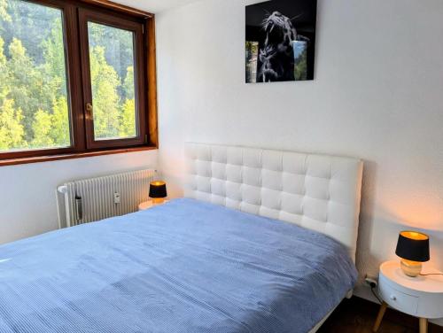 En eller flere senge i et værelse på Résidence Plandevin - 3 pièces à Arc 1600 MAE-1223