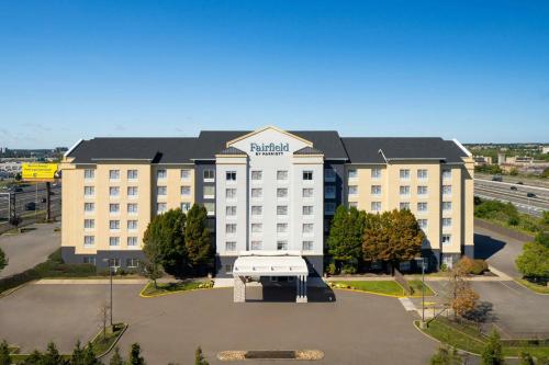 an aerial view of a hotel with a parking lot at Fairfield Inn & Suites by Marriott Newark Liberty International Airport in Newark