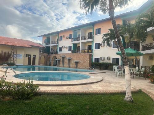 Swimmingpoolen hos eller tæt på Apartamento-flat no Porto das Dunas