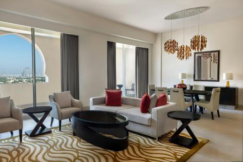 a living room with a couch and a table at Marriott Executive Apartments Al Jaddaf, Dubai in Dubai