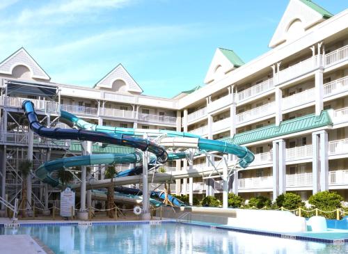 a water slide in a pool at a hotel at Holiday Inn Resort Orlando Suites - Waterpark by IHG in Orlando