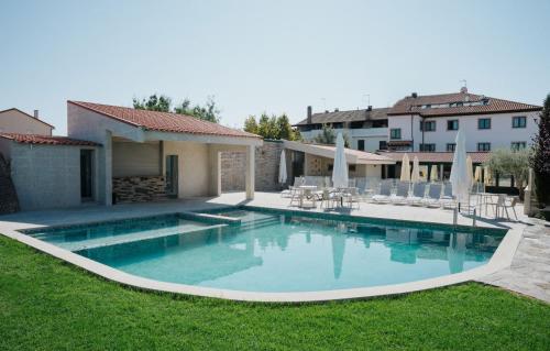 a swimming pool in the yard of a house at Hotel O Encontro in Sendim