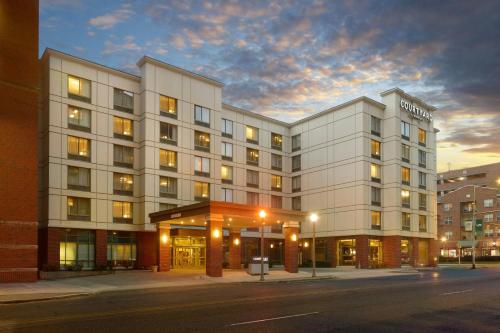 a large white building on a city street at night at Courtyard by Marriott Birmingham Downtown at UAB in Birmingham