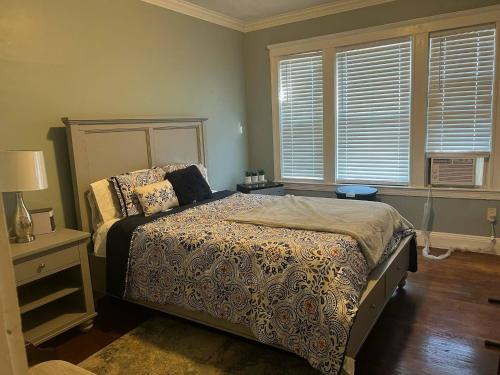 a bedroom with a bed and two windows at Casa Castor • Private Room 2 in Chelsea