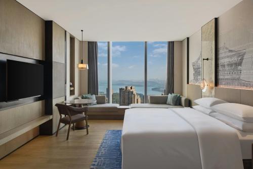 Voodi või voodid majutusasutuse Wuhan Marriott Hotel Wuchang toas