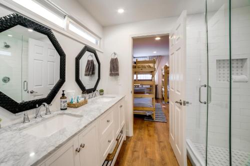 a bathroom with two sinks and a shower at Spacious Riverside Farmhouse, Perfectly Located in Edgemont