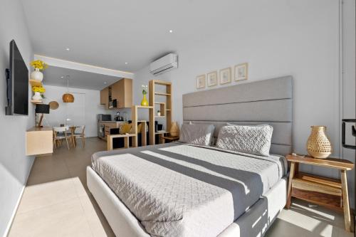 a bedroom with a large bed and a living room at Modern Ocean View Apartment Private Balcon in Nuevo Nayarit