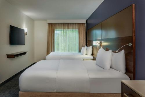 Postel nebo postele na pokoji v ubytování Residence Inn by Marriott Bath Brunswick Area