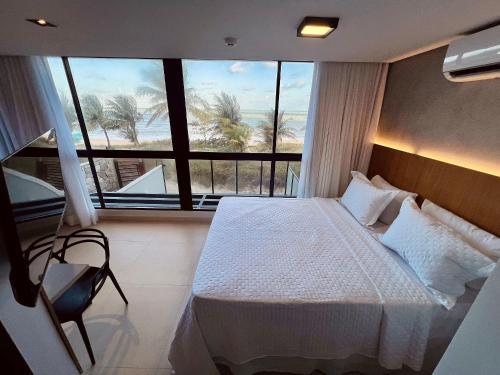 En eller flere senge i et værelse på Alta Marine