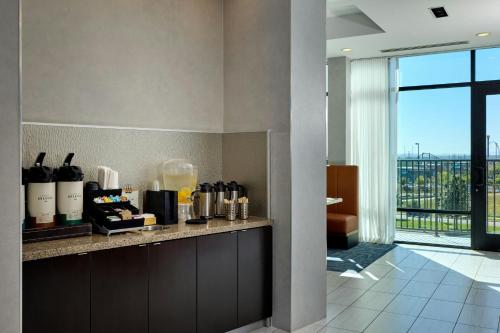 a kitchen with a counter with a counter top with a counter at Fairfield Inn & Suites by Marriott Denver Downtown in Denver